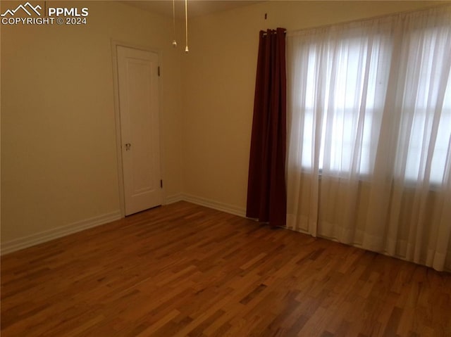 spare room featuring hardwood / wood-style flooring