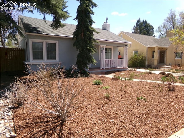 single story home featuring covered porch