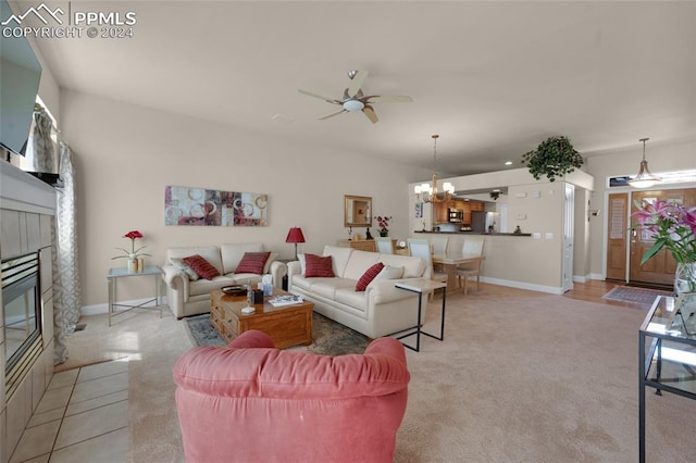 4529 Songglen Cir, Colorado Springs, CO 80906 - living room with light colored carpet, ceiling fan with notable chandelier, and a tiled fireplace
