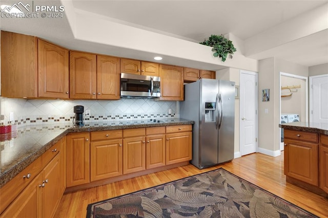 4529 Songglen Cir, Colorado Springs, CO 80906 - kitchen with tasteful backsplash, stainless steel appliances, and light wood-type flooring