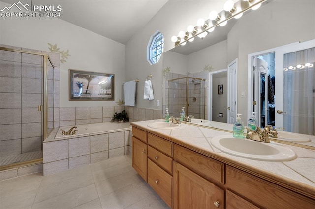 4529 Songglen Cir, Colorado Springs, CO 80906 - bathroom featuring dual sinks, oversized vanity, tile flooring, and plus walk in shower