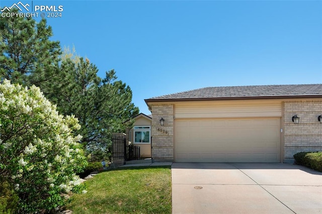 4529 Songglen Cir, Colorado Springs, CO 80906 - ranch-style home with a garage