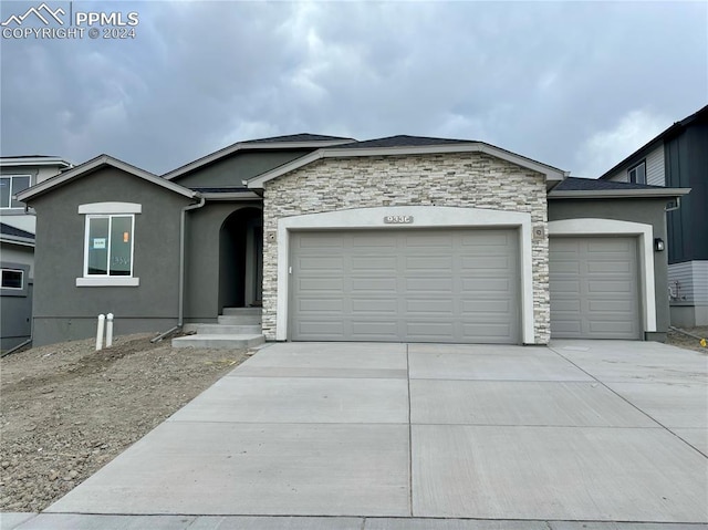 ranch-style house featuring a garage