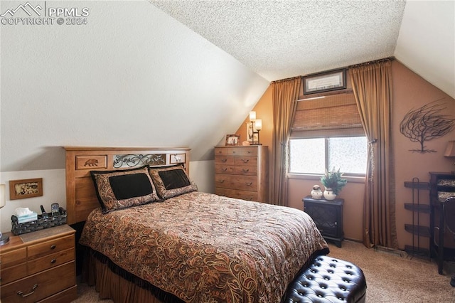 bedroom featuring a textured ceiling, a closet, carpet floors, and lofted ceiling