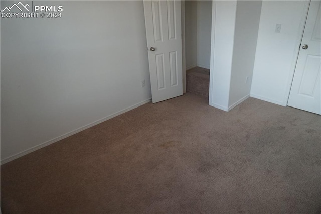 unfurnished bedroom with light carpet