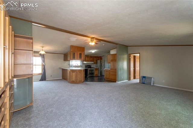 kitchen with ornamental molding, stainless steel appliances, and carpet floors