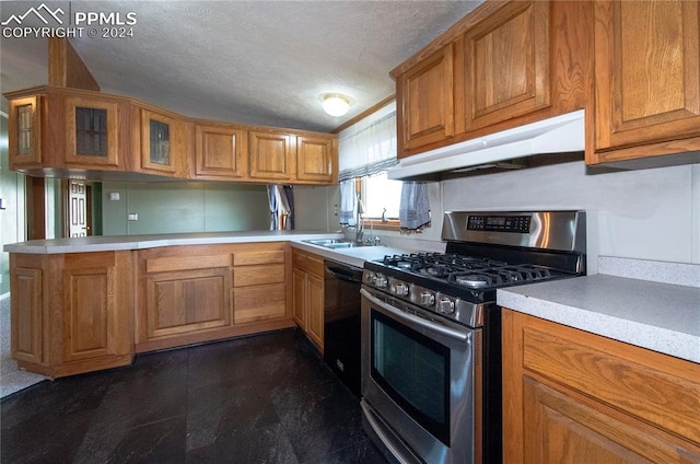 kitchen featuring a textured ceiling, gas range, sink, black dishwasher, and kitchen peninsula