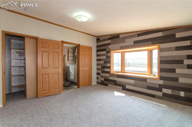 unfurnished bedroom with carpet floors and ornamental molding