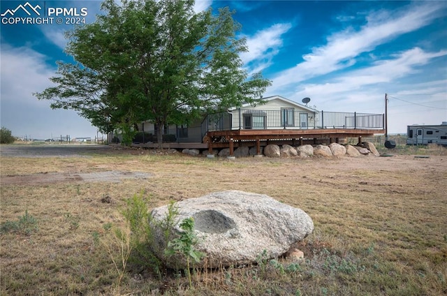 view of yard featuring a deck