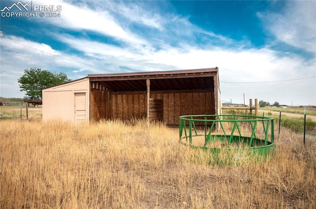 view of outbuilding featuring a rural view