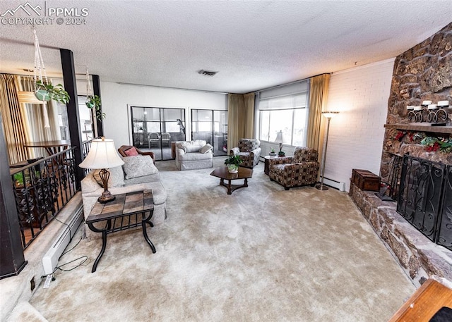 living room featuring light carpet, a fireplace, and a textured ceiling