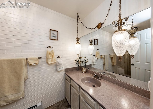 bathroom with vanity with extensive cabinet space and tile walls