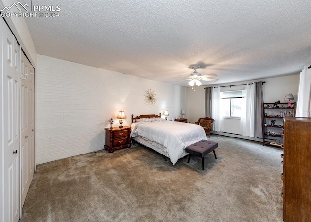 bedroom with dark colored carpet, ceiling fan, a textured ceiling, baseboard heating, and a closet