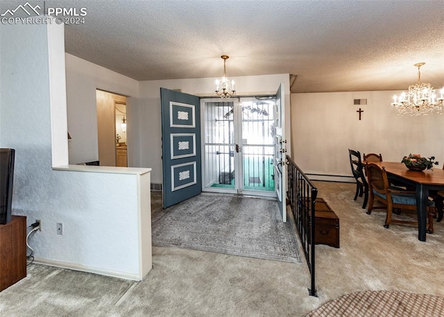 carpeted entryway with french doors, a chandelier, a baseboard radiator, and a textured ceiling