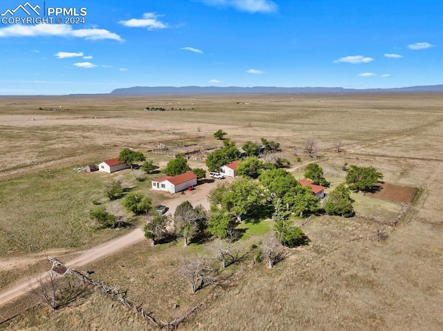 birds eye view of property with a rural view