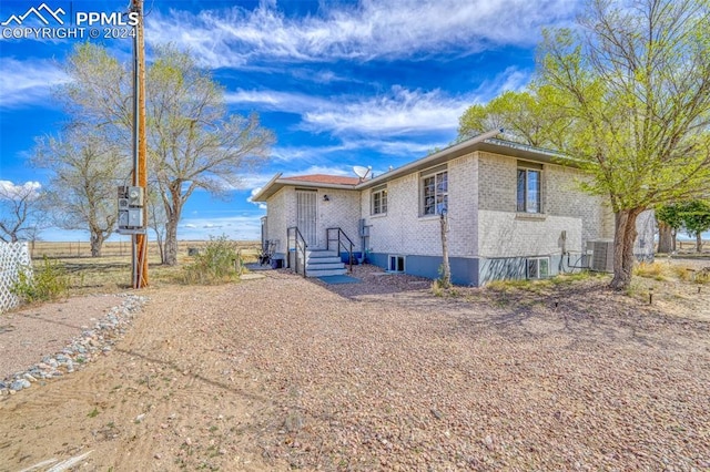 view of front of house featuring central AC unit