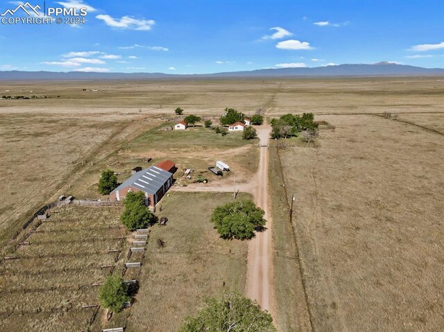 bird's eye view featuring a mountain view and a rural view