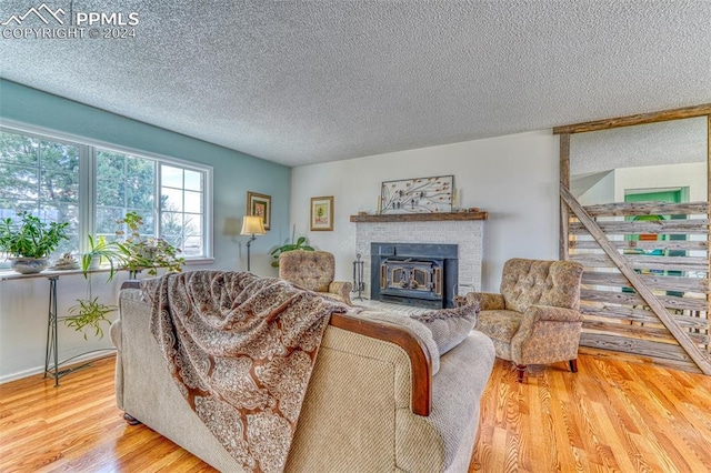 living room featuring hardwood / wood-style floors and a textured ceiling