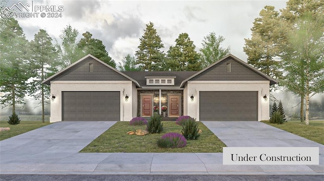 view of front of home featuring a garage and a front yard