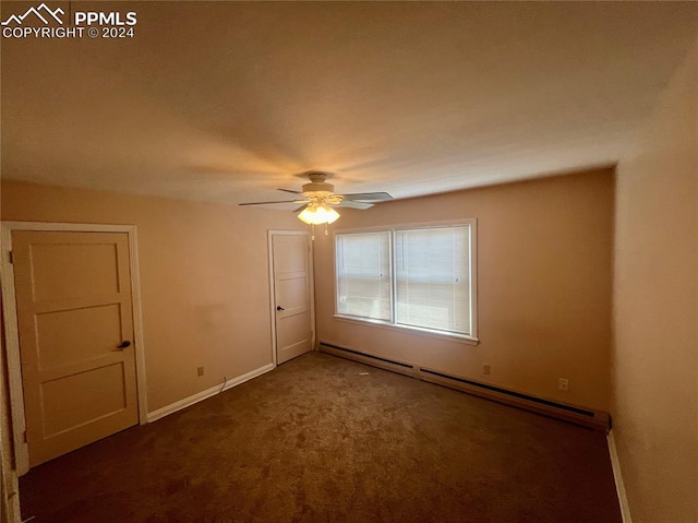 spare room with a baseboard heating unit, ceiling fan, and carpet floors