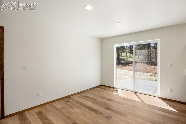 spare room featuring light hardwood / wood-style floors