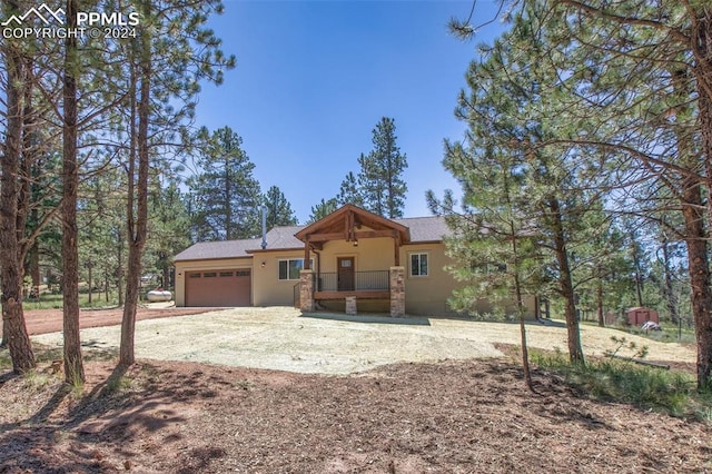 view of front of house with a garage and covered porch