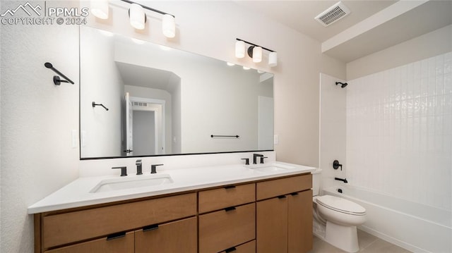 full bathroom with shower / tub combination, vanity, toilet, and tile patterned floors