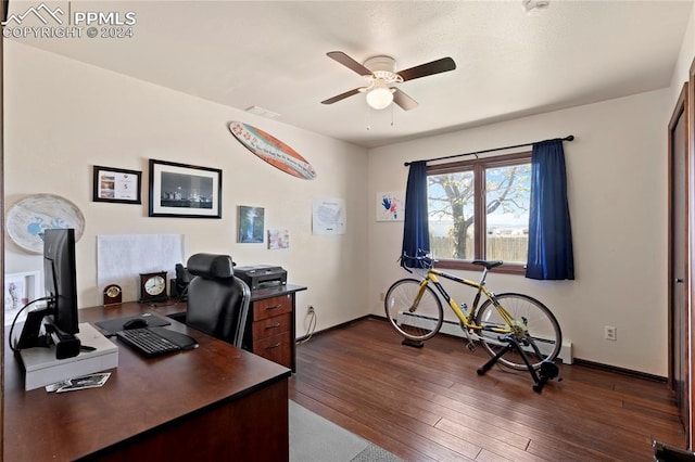 office featuring a baseboard heating unit, dark hardwood / wood-style flooring, and ceiling fan