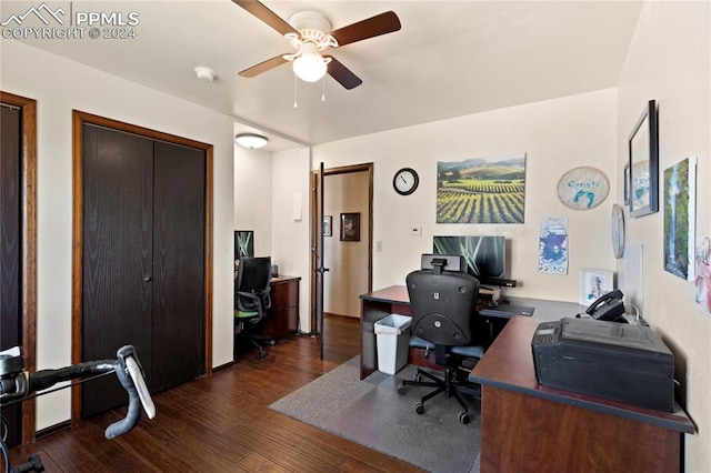 home office featuring dark hardwood / wood-style flooring and ceiling fan