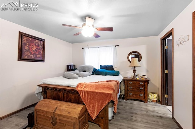 bedroom featuring hardwood / wood-style flooring and ceiling fan