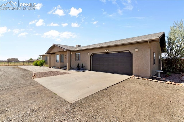 single story home with a garage