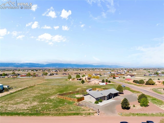 aerial view with a mountain view and a rural view