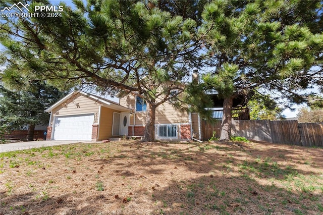 view of front of property with a garage