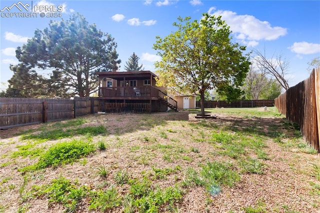 view of yard with a deck