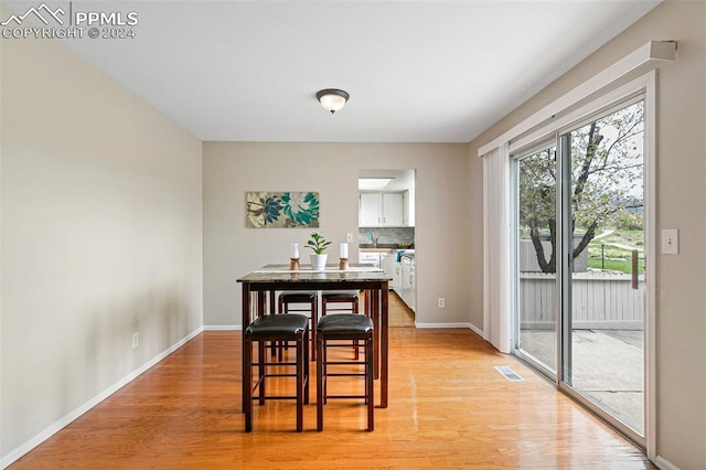 dining area with light wood-type flooring