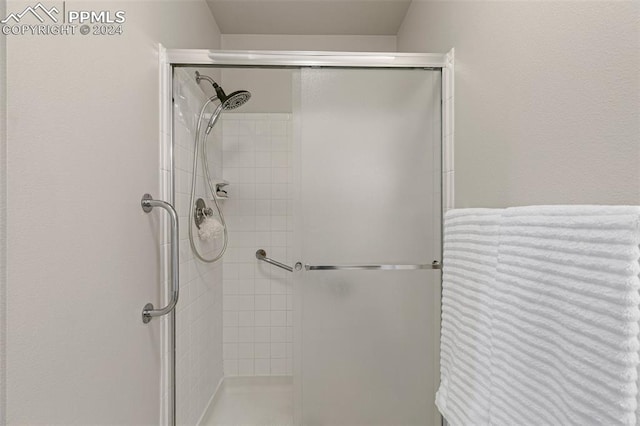 bathroom featuring an enclosed shower