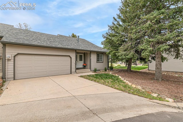 ranch-style home with a garage