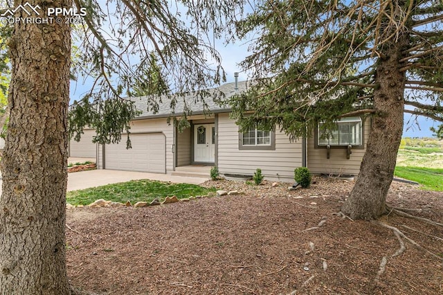 ranch-style house featuring a garage