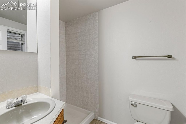 bathroom featuring oversized vanity and toilet