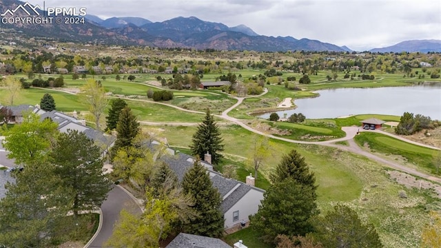 drone / aerial view featuring a water and mountain view