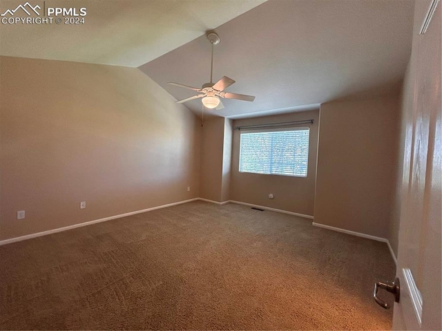 unfurnished room with carpet flooring, ceiling fan, and lofted ceiling