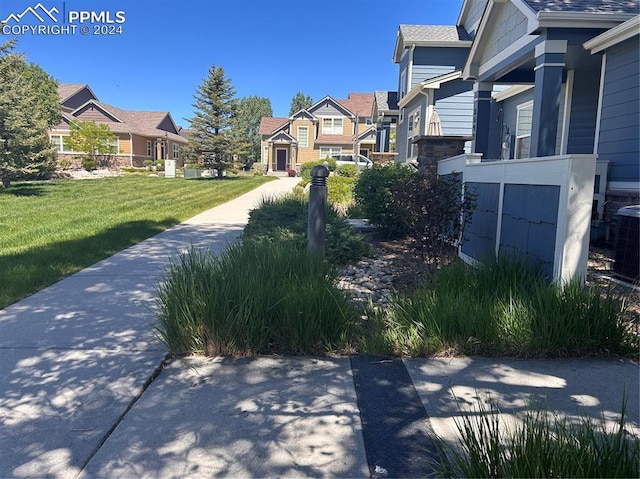 view of community featuring a lawn