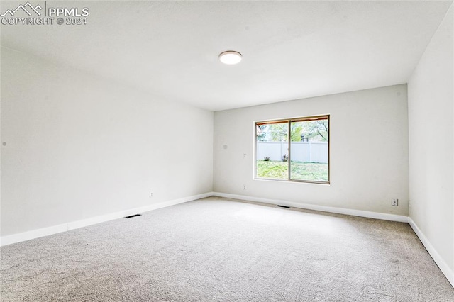 empty room featuring carpet floors