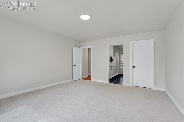 unfurnished bedroom featuring carpet flooring