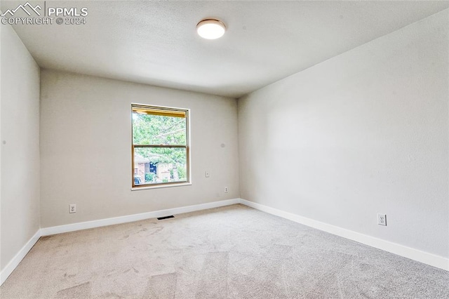 spare room with carpet floors