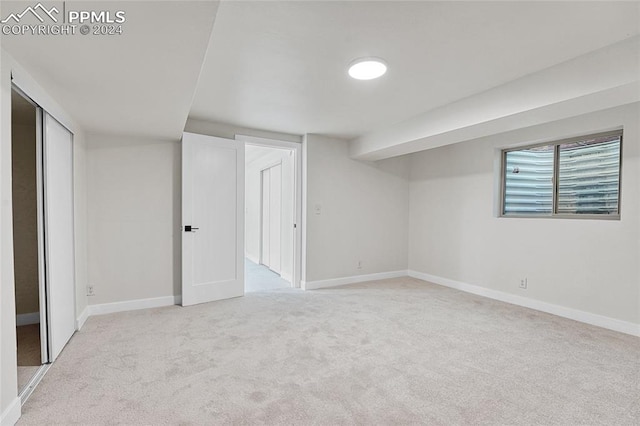 additional living space with light colored carpet