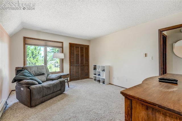 living room with vaulted ceiling, a textured ceiling, and carpet flooring