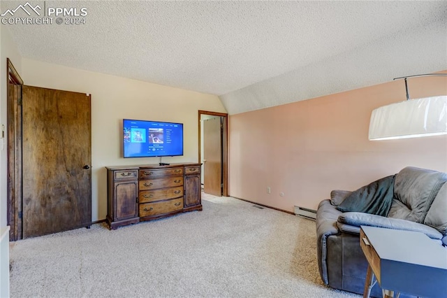 interior space featuring carpet flooring, vaulted ceiling, a baseboard heating unit, and a textured ceiling