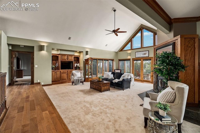 living room featuring wood-type flooring, french doors, high vaulted ceiling, and ceiling fan