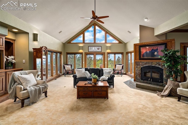 living room featuring light colored carpet, high vaulted ceiling, and ceiling fan